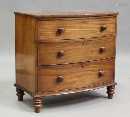 A Victorian mahogany bowfront chest of three long drawers, o...