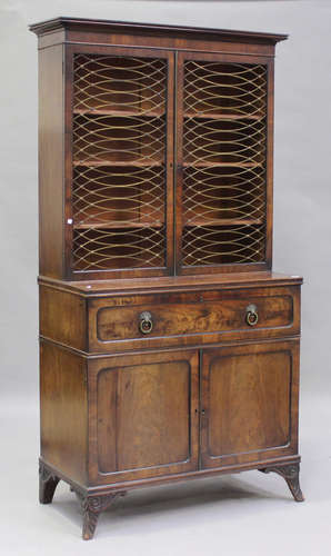 A Regency figured mahogany secrétaire bookcase cabinet, the ...