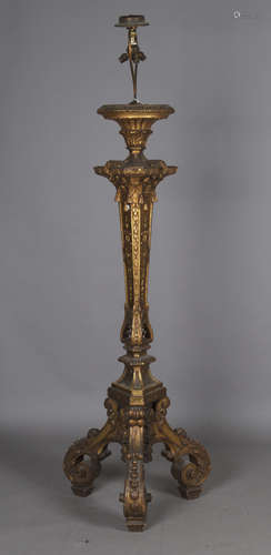 An impressive Baroque Revival giltwood triform torchère lamp...