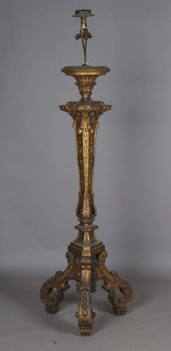 An impressive Baroque Revival giltwood triform torchère lamp...