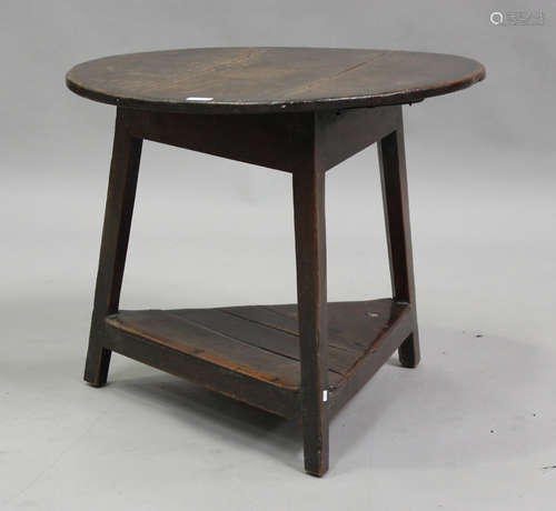 A late 18th century provincial oak circular cricket table, r...