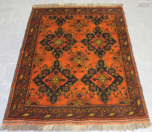 An Afghan Beluche rug, late 20th century, the deep chestnut ...