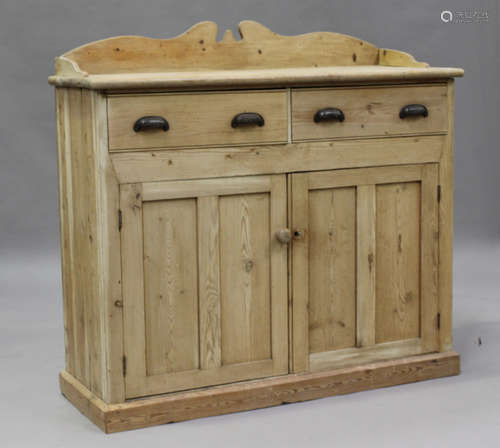 A late 19th/early 20th century pine side cabinet with a shap...