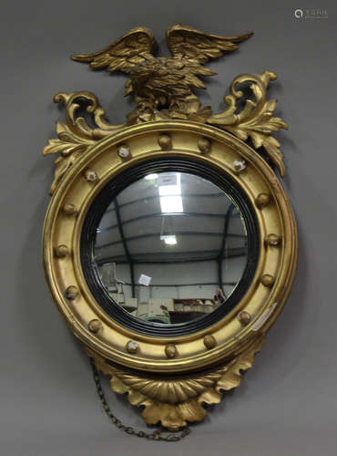 A 19th century Regency style giltwood and gesso framed circu...