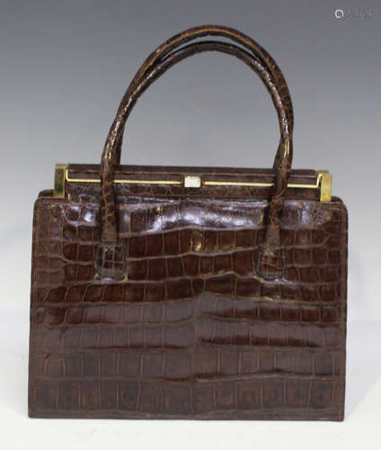 A mid-20th century crocodile skin handbag with gilt metal mo...