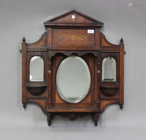 A late Victorian rosewood and foliate inlaid wall shelf with...