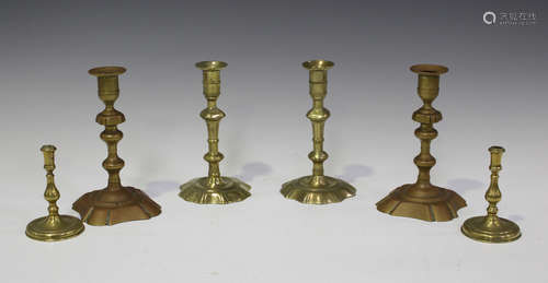 A pair of George III brass knop stem candlesticks with shape...