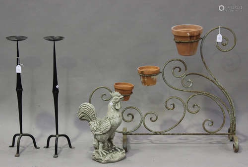 A late 20th century wrought iron garden flowerpot stand in t...