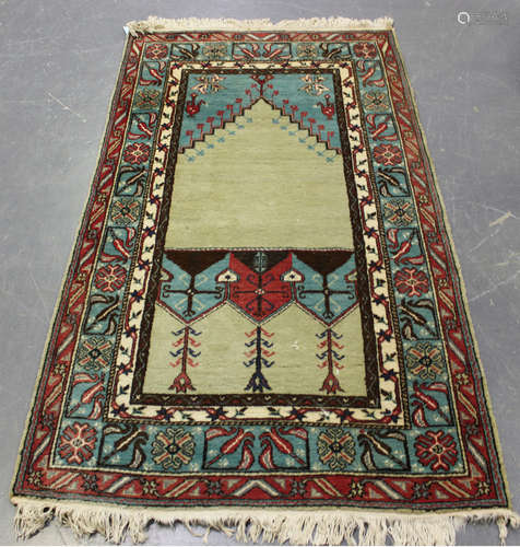 A Turkish prayer rug, mid/late 20th century, the pale green ...