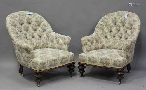 A pair of mid-Victorian tub back easy chairs, each upholster...