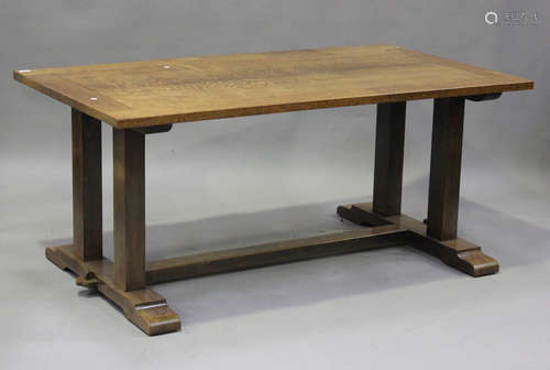 An early 20th century Arts and Crafts oak refectory dining t...