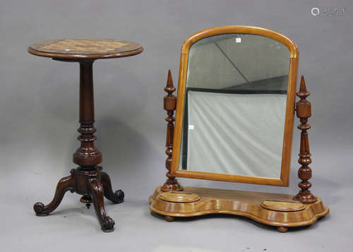 A Victorian walnut circular games table, the top with inlaid...