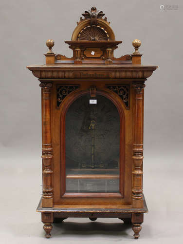 A late 19th century German walnut cased upright penny-in-the...