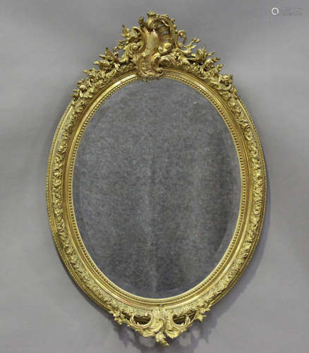 A 19th century giltwood and gesso oval wall mirror with pier...