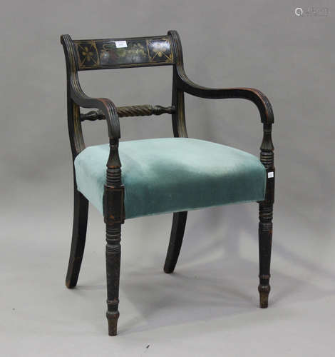 A Regency ebonized elbow chair with gilt painted decoration,...