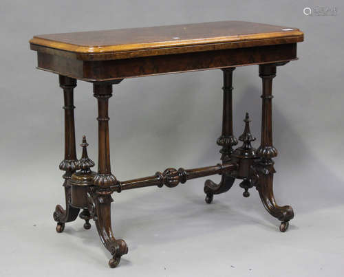 A Victorian burr walnut fold-over card table, raised on turn...