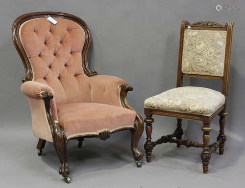 A late Victorian mahogany showframe armchair, upholstered in...