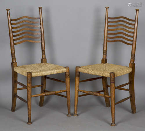 A pair of Edwardian Arts and Crafts ash framed dining chairs...