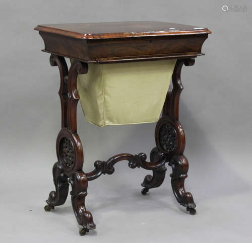 An early Victorian rosewood work table, the hinged lid above...