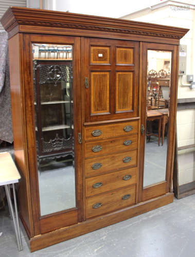 An Edwardian mahogany and satinwood crossbanded three-sectio...