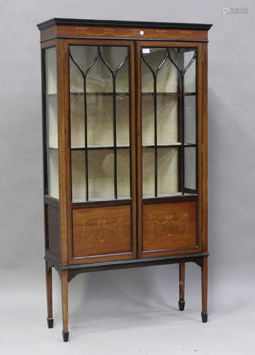 An Edwardian mahogany display cabinet, fitted with a pair of...