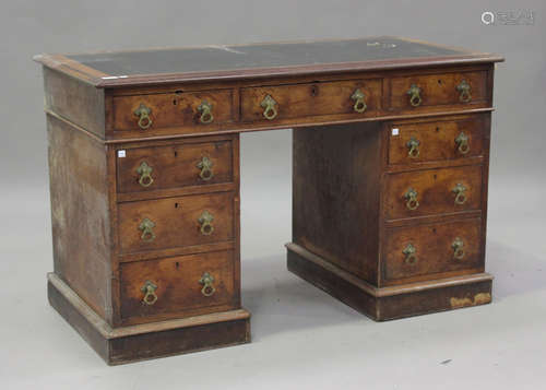 A late Victorian walnut twin pedestal desk, fitted with an a...