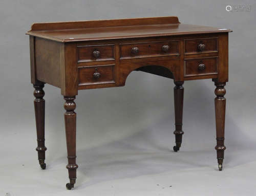 A Victorian mahogany kneehole side table, fitted with five d...