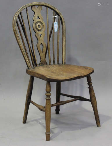 A 19th century primitive ash and elm Windsor kitchen chair, ...