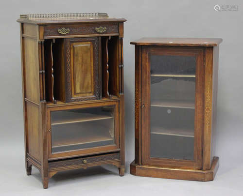 An Edwardian mahogany music cabinet with blind fretwork deco...