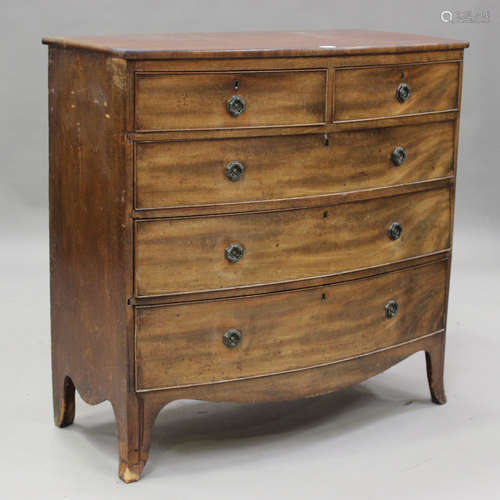 An early Victorian mahogany bowfront chest of two short and ...