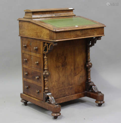 A Victorian walnut Davenport desk, the hinged writing surfac...