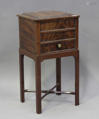 A 19th century and later mahogany work table, the hinged lid...