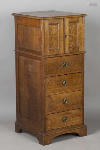 An early/mid-20th century Arts and Crafts style oak narrow c...