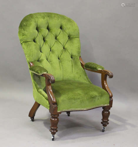 An early Victorian mahogany buttoned back library armchair, ...