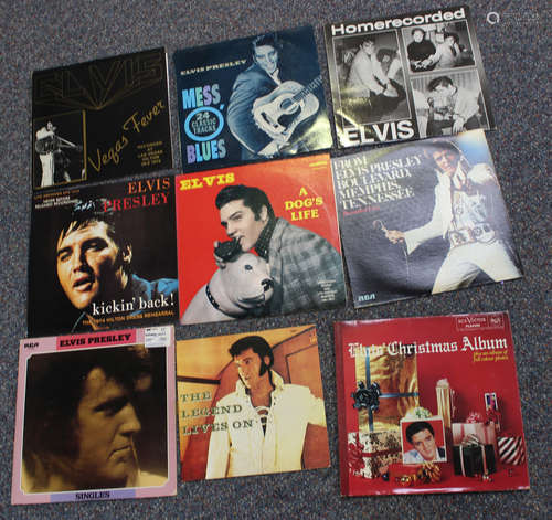 A collection of Elvis Presley LP records and singles.Buyer’s...