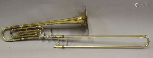 A brass 'Emperor' trombone by Boosey & Hawkes Ltd, with hard...