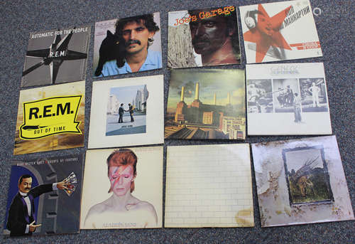 A collection of LP records, including albums by Frank Zappa,...