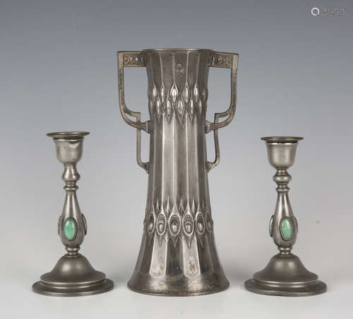 A pair of Arts and Crafts pewter candlesticks by Collingwood...