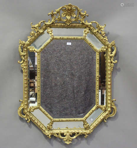 An early 20th century French giltwood sectional wall mirror ...