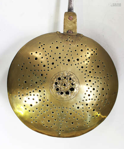 An 18th century brass and steel handled warming pan, length ...