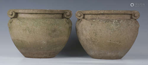 A pair of Compton Pottery terracotta scroll pots, after a de...