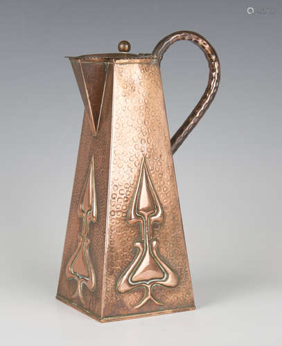 An Edwardian Art Nouveau copper water jug, probably by Josep...