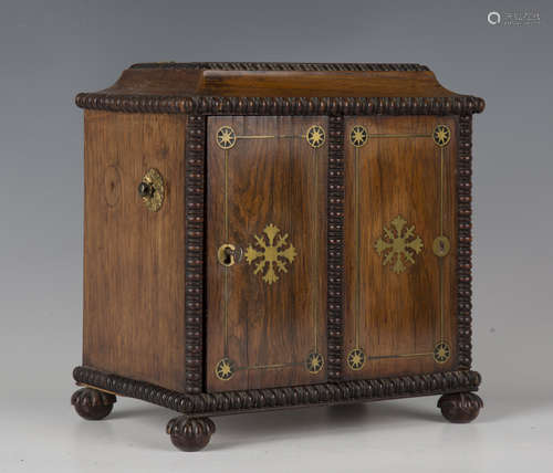 A Regency rosewood and brass inlaid table-top cabinet, the d...