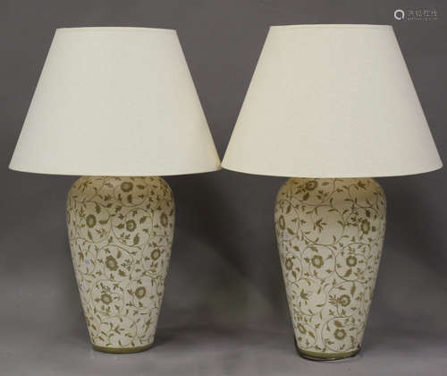 A pair of modern pottery table lamps, painted with flowering...