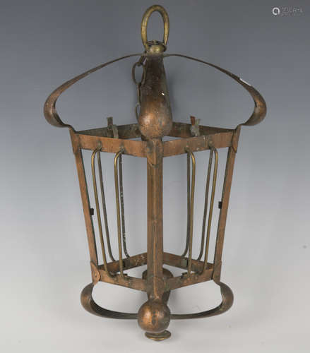 An early 20th century Arts and Crafts copper and brass mount...