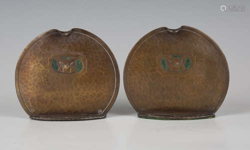 A pair of early 20th century Arts and Crafts copper bookends...