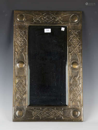 An early 20th century Arts and Crafts brass rectangular wall...