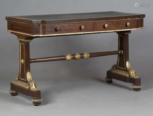 An early Victorian mahogany and parcel gilt writing table by...