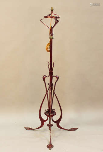 A late Victorian Arts and Crafts painted wrought metal adjus...