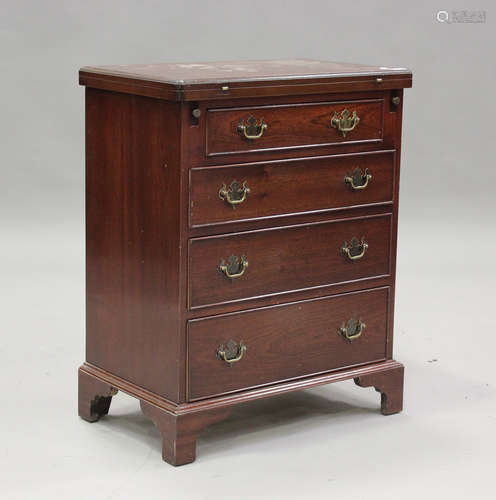 A 20th century reproduction mahogany bachelor's chest of fou...